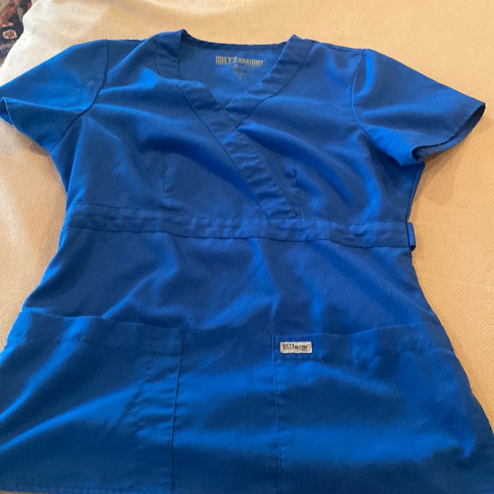Royal blue scrub top in good used condition.